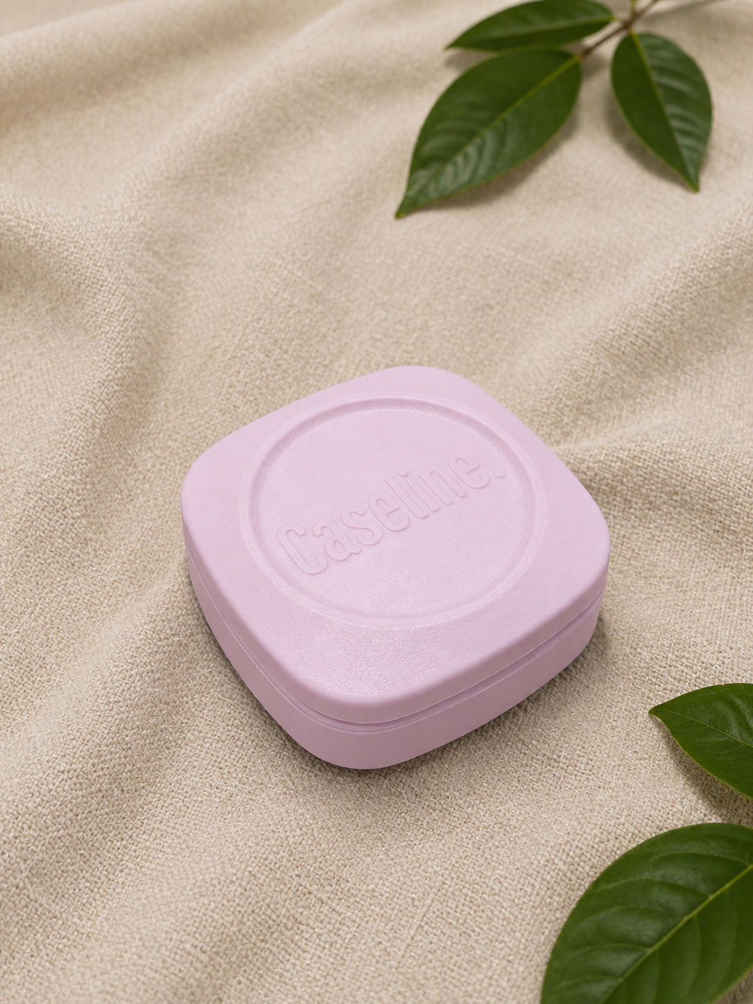 Caseline pink case top/side view closed on a neutral background